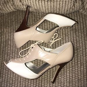 Marc Fisher female wing tip peep toe 2 tone heel.